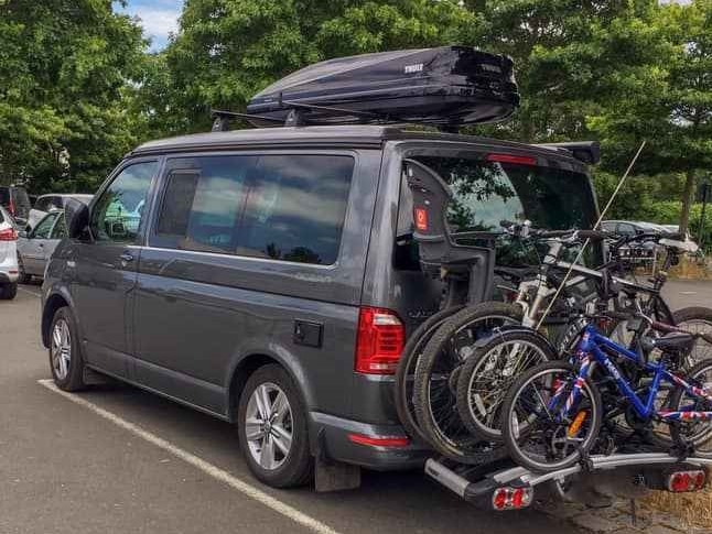 VW Campervan with Thule bike rack and roof box attached